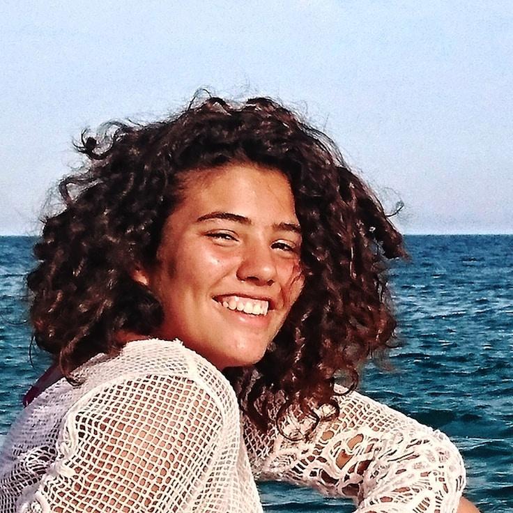 Kaveri Mehta, Lead Design Curator at Star Light Meadow Sector, reviewing corporate floral arrangements